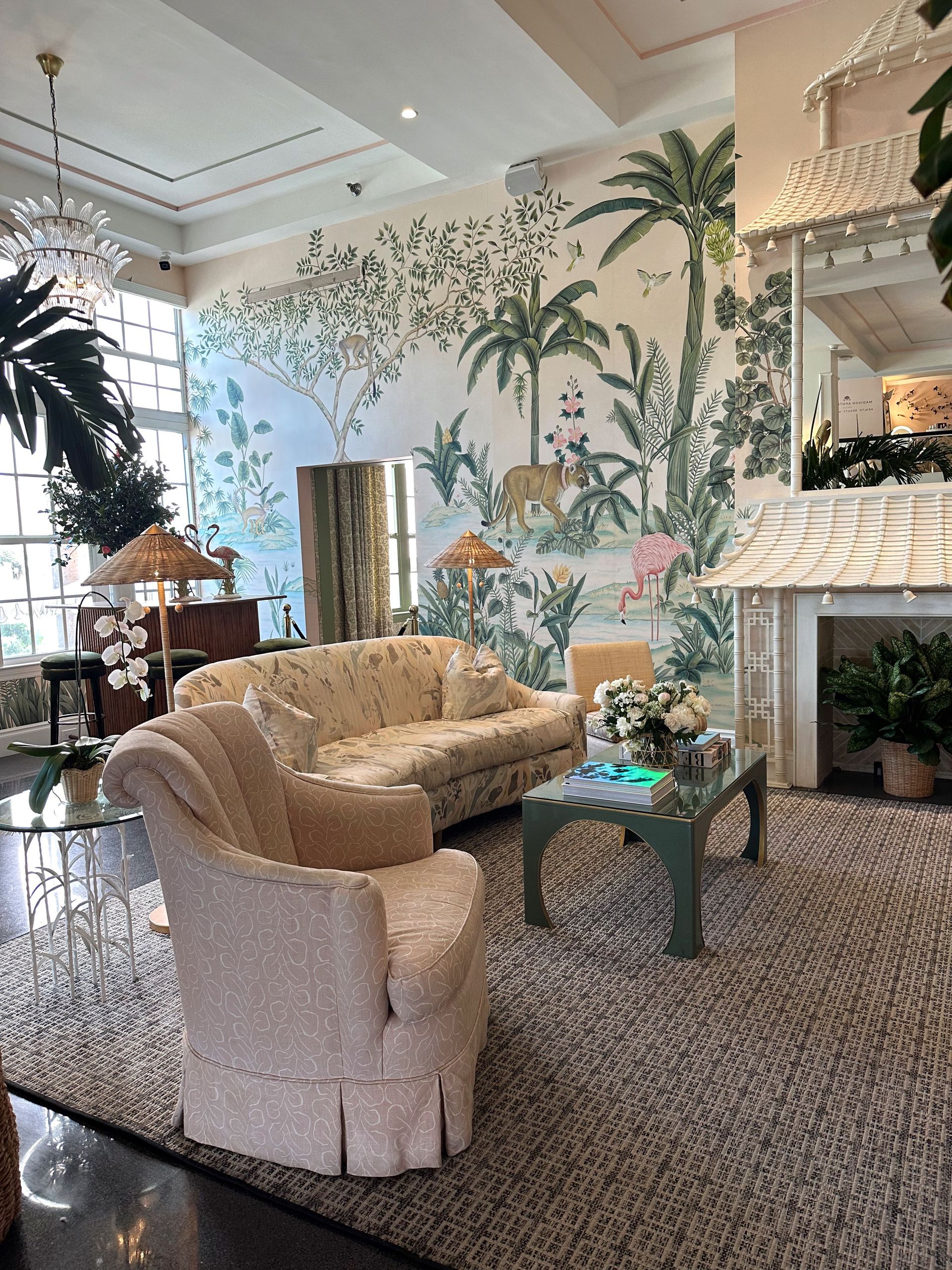 Sophisticated living room with lush plant decor, capturing a tropical oasis feel.